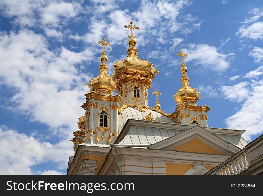 The golden orthodox church against the sky background. The golden orthodox church against the sky background