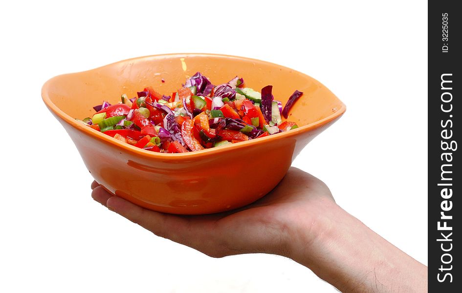 Vegetable salad in orange plate on white background. Vegetable salad in orange plate on white background