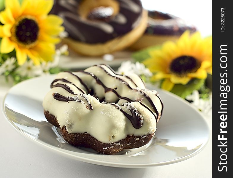 White chocolate donut on a saucer. White chocolate donut on a saucer