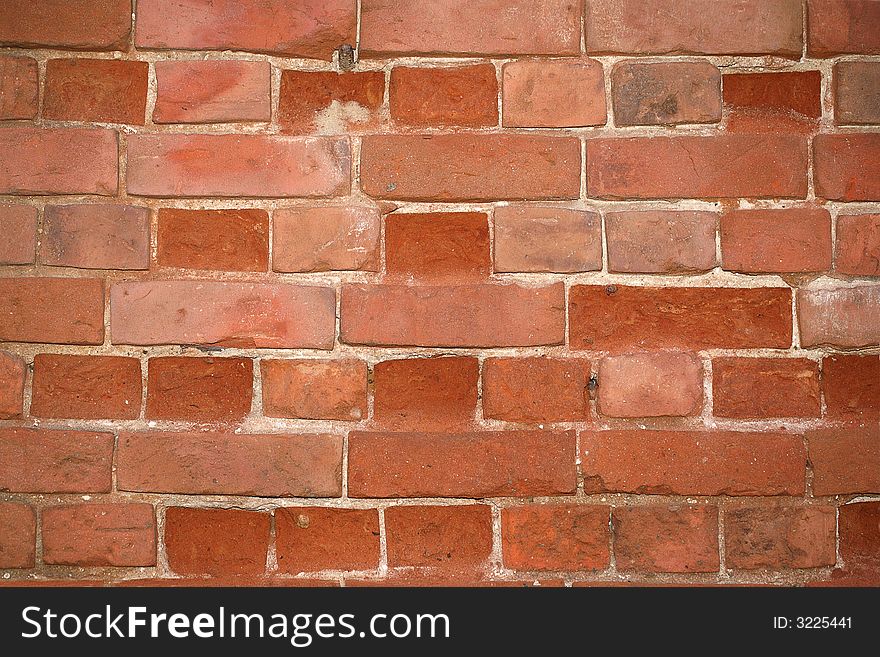 The old cracked wall from a red brick. The old cracked wall from a red brick