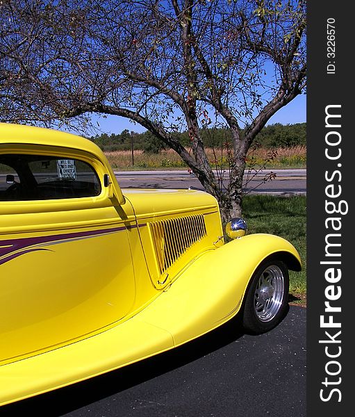 Vintage yellow street rod in mint condition. Vintage yellow street rod in mint condition.