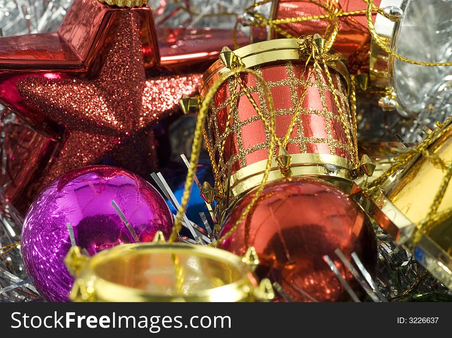 Heap of colorful christmas tree decorations of different types