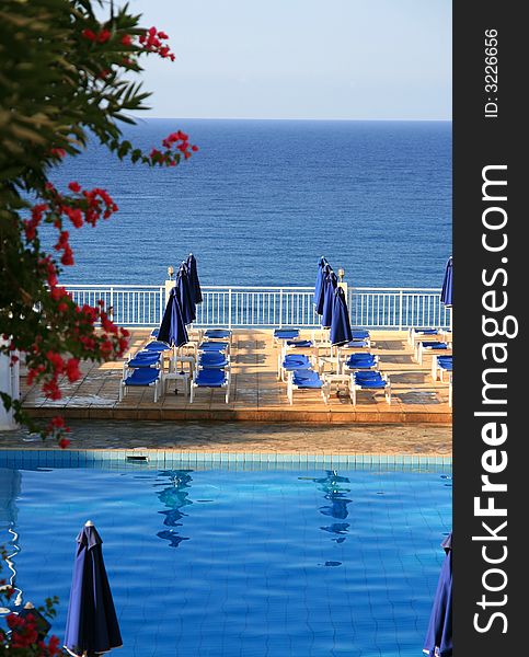 View of swimming pool and ocean at a tourist resort