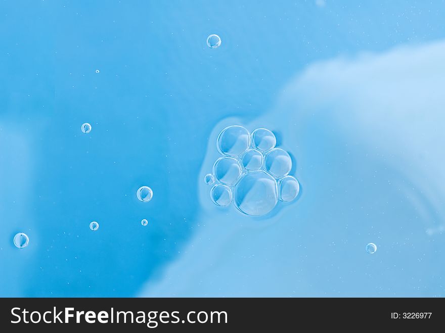 Abstract blue background with air bubbles on water surface