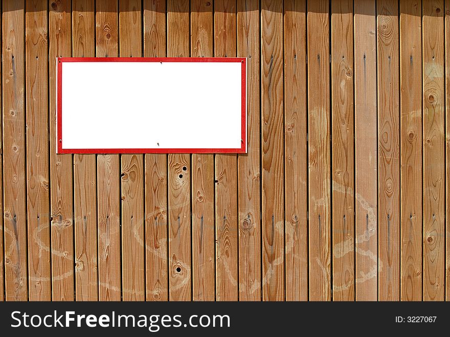 Blank warning sign with red frame on wooden wall. Blank warning sign with red frame on wooden wall