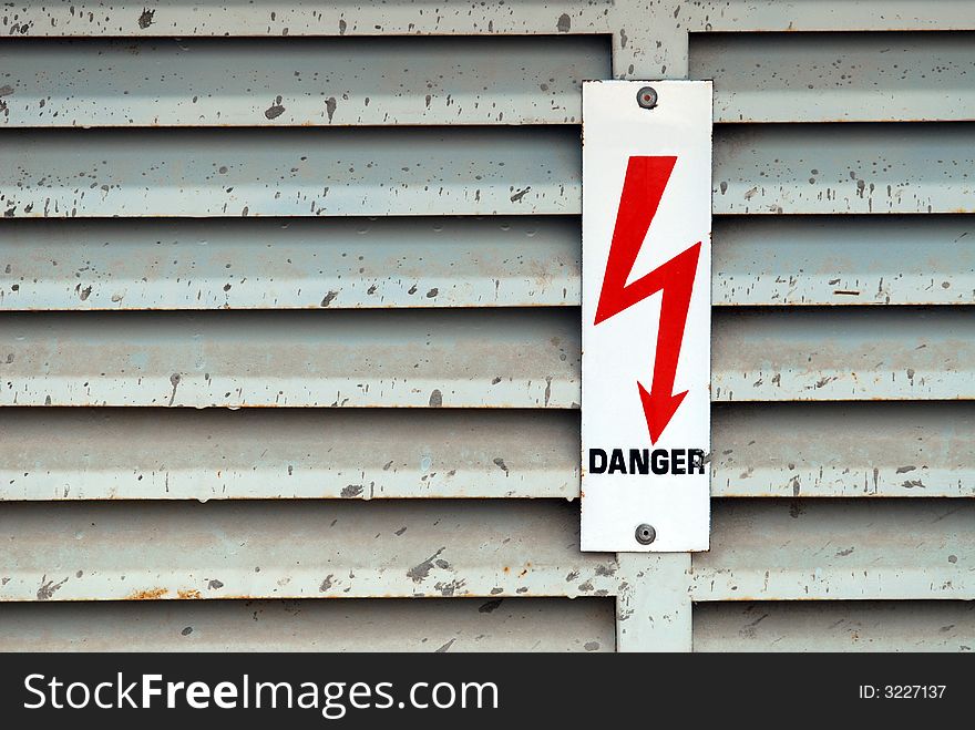 Electricity danger lightning sign on old metal surface. Electricity danger lightning sign on old metal surface