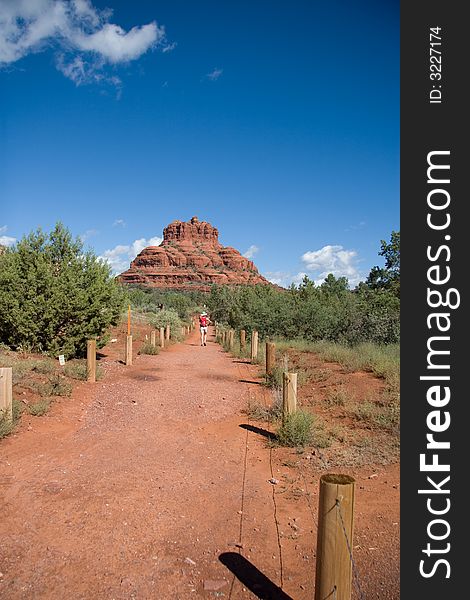 A hiker in the distance making her way to Bell Rock. A hiker in the distance making her way to Bell Rock.