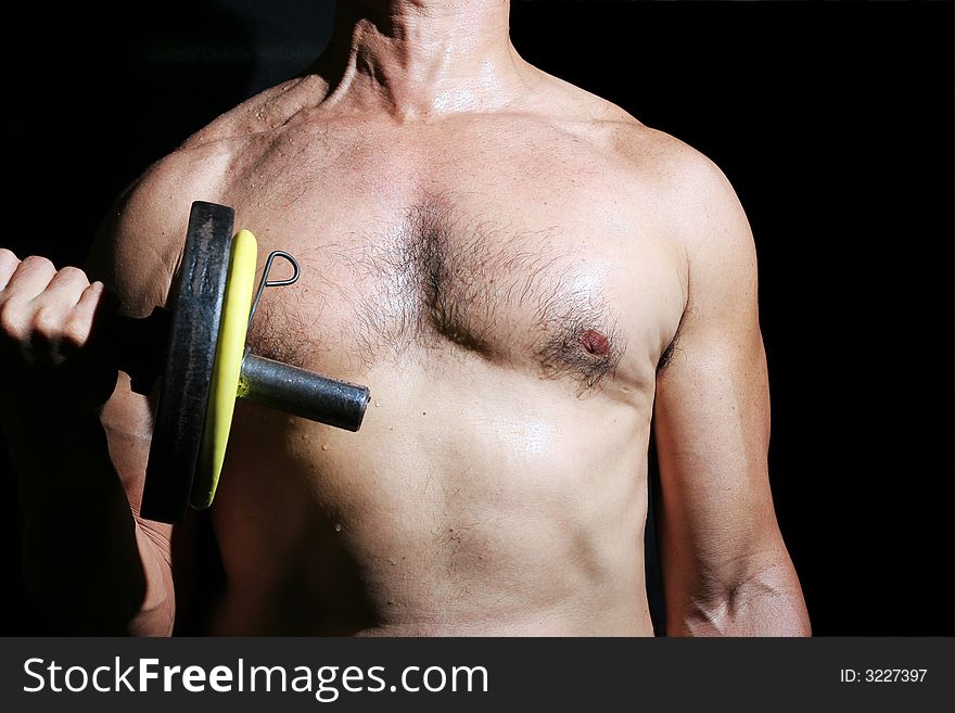 Man making physical exercise in the gymnasium. Man making physical exercise in the gymnasium