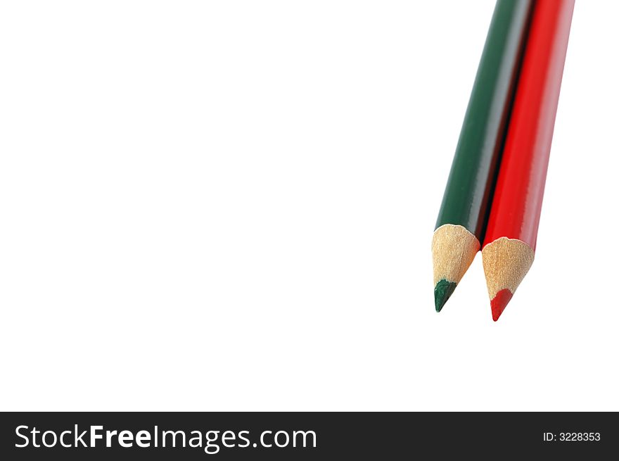 Red and green colored pencils isolated on white background. Red and green colored pencils isolated on white background.