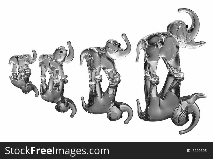Elephant statues on white with reflection