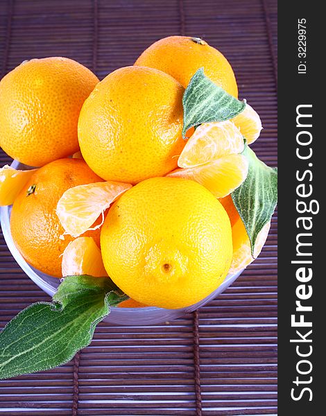 Fresh tangerine and orange isolated on white background