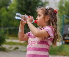 Girl Drinks Water Stock Photography