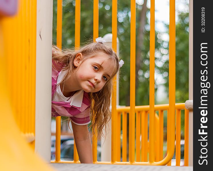 Little girl playing on the playground. Little girl playing on the playground