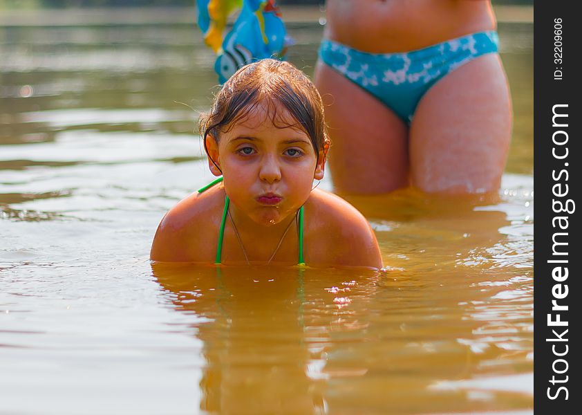 Little girl swimming in water