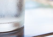 Cool Glass On Wooden Table And Dew Stock Photo