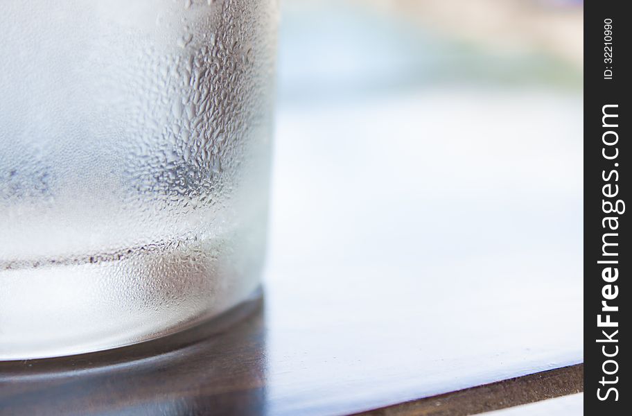 Cool Glass On Wooden Table And Dew