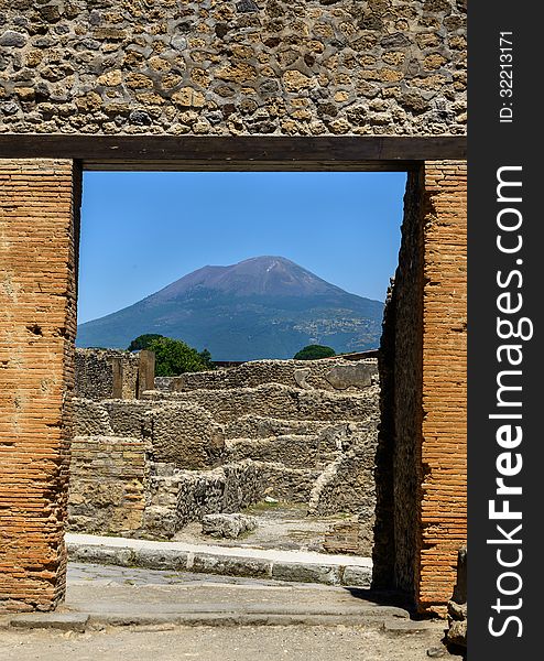 Ruins of Pompeii with Mt. Vesuvius in the background. Photo taken in June of 2013. Ruins of Pompeii with Mt. Vesuvius in the background. Photo taken in June of 2013