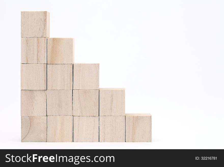 Stack of wooden toy blocks on white background