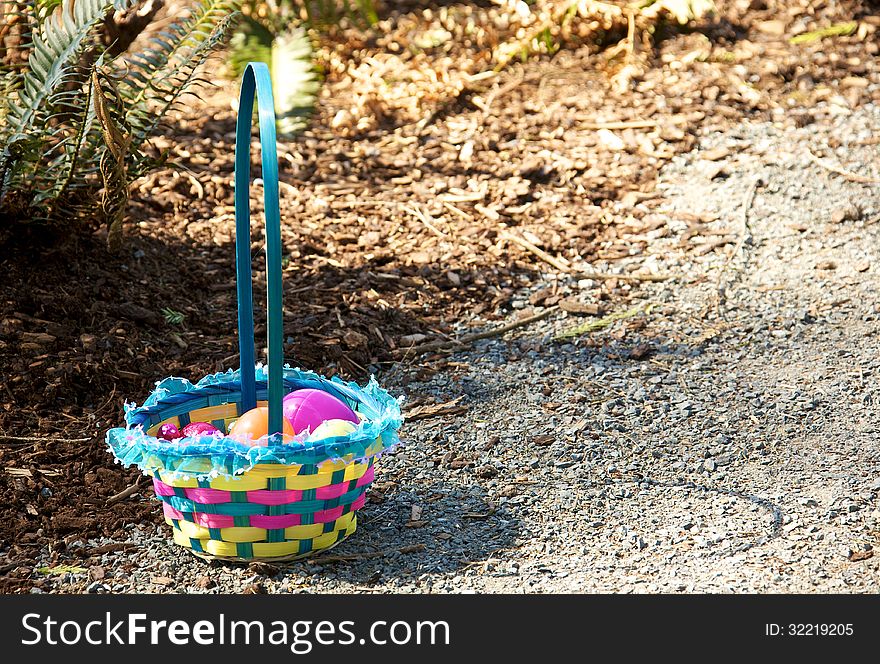 A child's Easter Egg basket full of chocolate eggs. A child's Easter Egg basket full of chocolate eggs