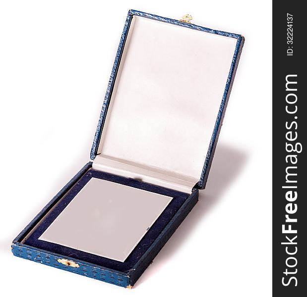 Silver medal in old blue box on white background. Silver medal in old blue box on white background.