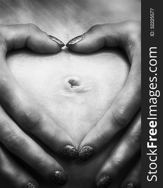 Pregnant women heart made of hand...black and white. Pregnant women heart made of hand...black and white