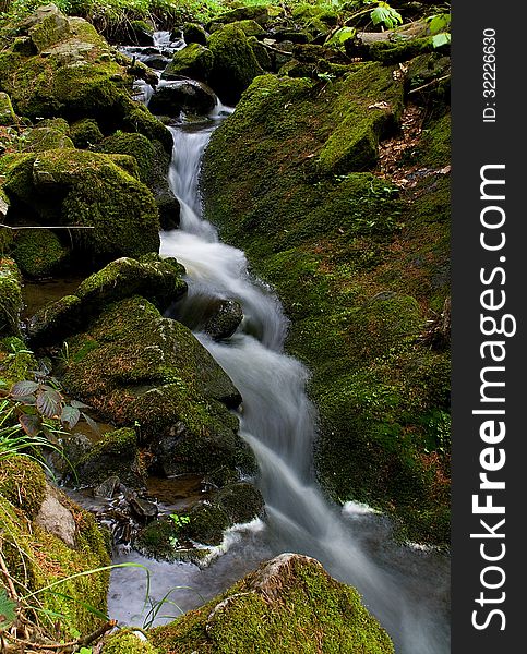 Small stream in the rocky river in czech republic