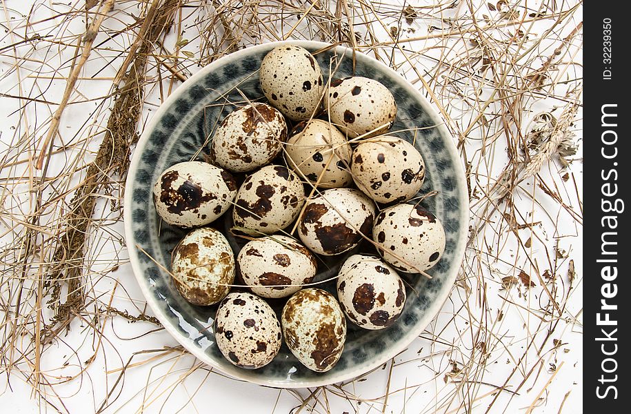 Top view on ceramic plate with quail eggs. Top view on ceramic plate with quail eggs