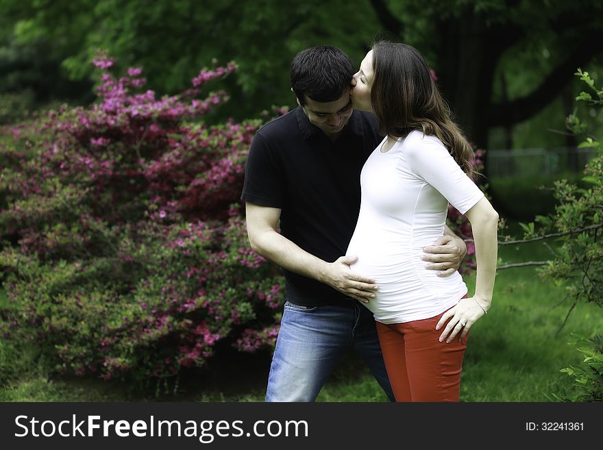 Lovely Pregnant Couple In Nature
