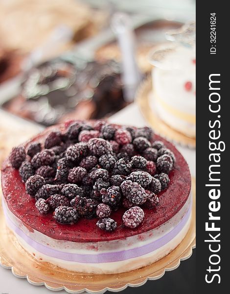 Cake with blackberries with blurred background. Cake with blackberries with blurred background
