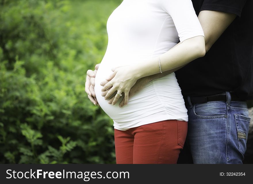 A belly of a beautiful pregnant woman. A belly of a beautiful pregnant woman