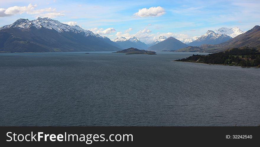 Spectacular snow-capped mountains rise on the banks of Lake Wakatipu in the famous Glenorchy region of New Zealand. Spectacular snow-capped mountains rise on the banks of Lake Wakatipu in the famous Glenorchy region of New Zealand.