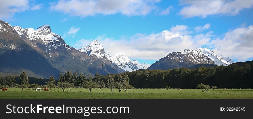 Spectacular snow-capped mountains rise from the famous Glenorchy region of New Zealand. Spectacular snow-capped mountains rise from the famous Glenorchy region of New Zealand.