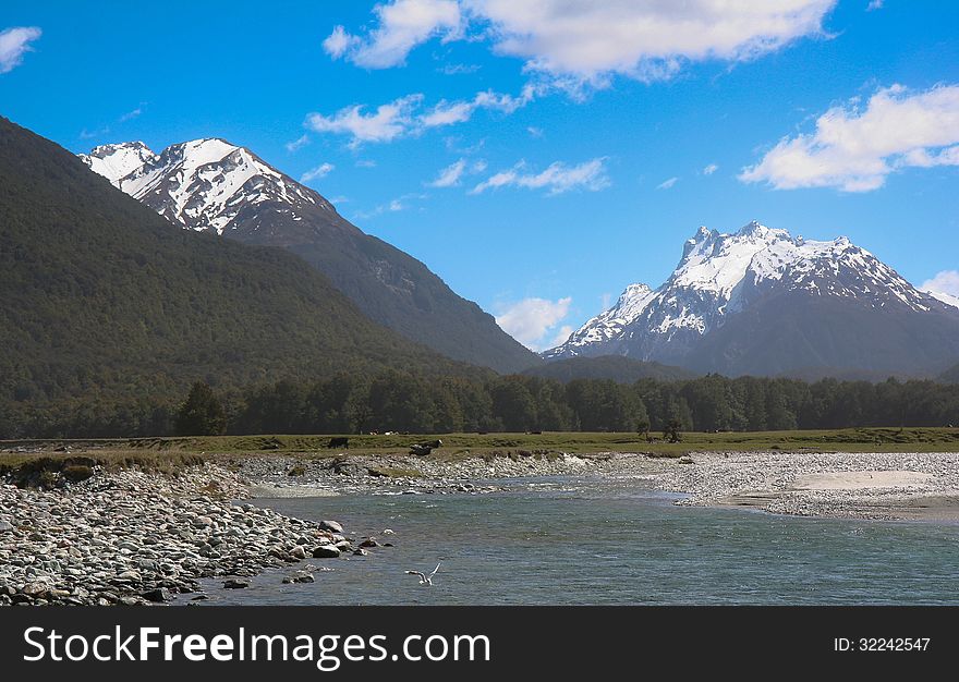 Spectacular snow-capped mountains rise from the famous Glenorchy region of New Zealand. Spectacular snow-capped mountains rise from the famous Glenorchy region of New Zealand.