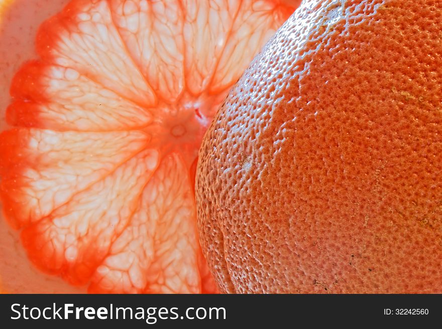 Glass of grapefruit juice with a slice of grapefruit