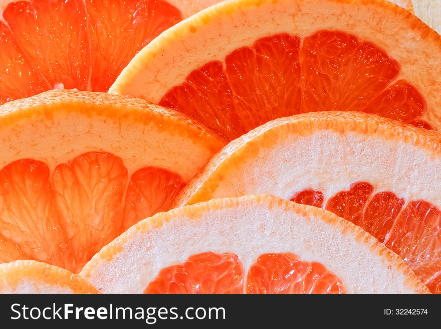 Glass of grapefruit juice with a slice of grapefruit