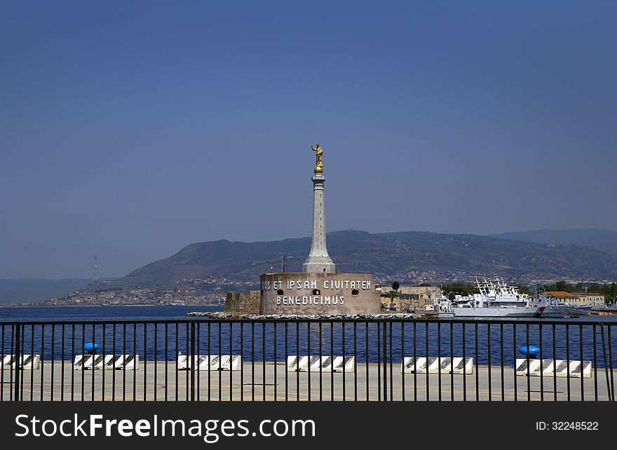 The harbour of Messina protects Fort santissimo canal Salvatore. It is built in the XVI century. Its high-rise dominant is Обетная column with a gilded statue of the Madonna ,the patroness of the city. There is a legend according to which the mother of God in 42 ad sent to the city residents letter, blessing them. These words are written on the wall of the Fort and mean: we Bless you and your city. The harbour of Messina protects Fort santissimo canal Salvatore. It is built in the XVI century. Its high-rise dominant is Обетная column with a gilded statue of the Madonna ,the patroness of the city. There is a legend according to which the mother of God in 42 ad sent to the city residents letter, blessing them. These words are written on the wall of the Fort and mean: we Bless you and your city.