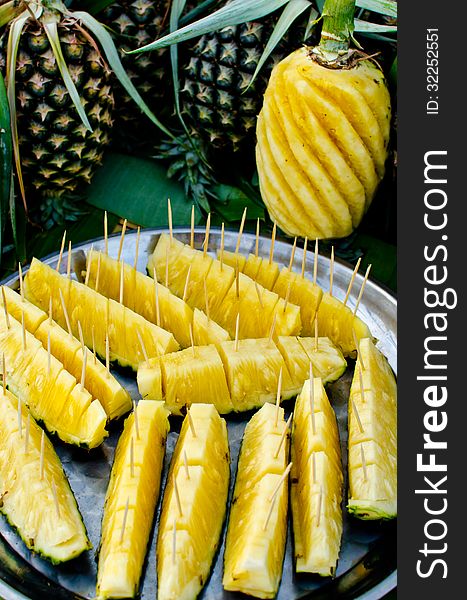 General pineapple in Thailand. Cut ready with toothpicks on for easy eating.