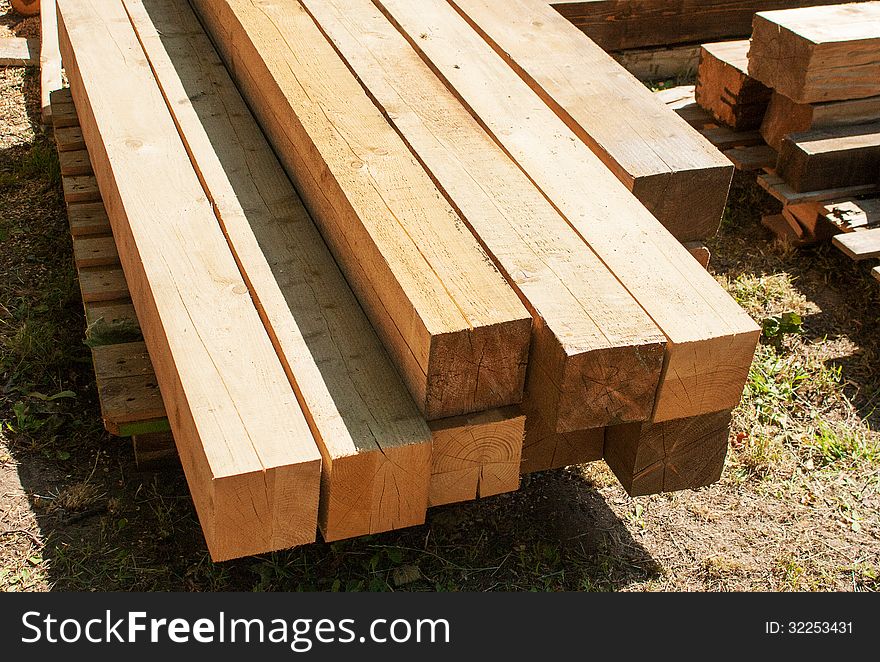 Wooden boards for construction outside on summer day