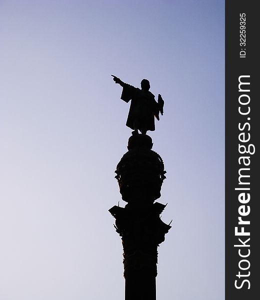 In this monument Columbus points wiht his finger from a high point. In this monument Columbus points wiht his finger from a high point.