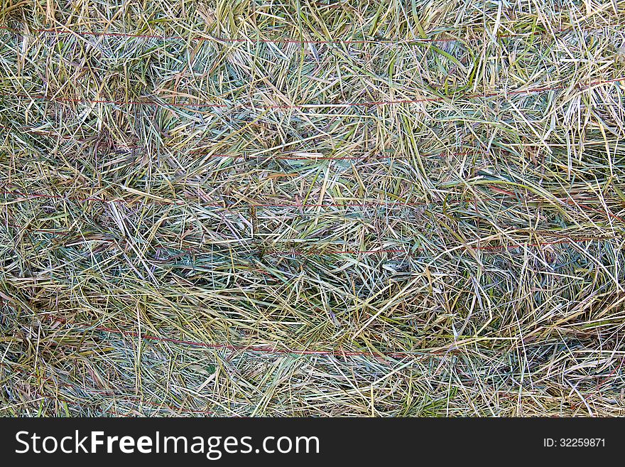 A close-up of a large bale of hay