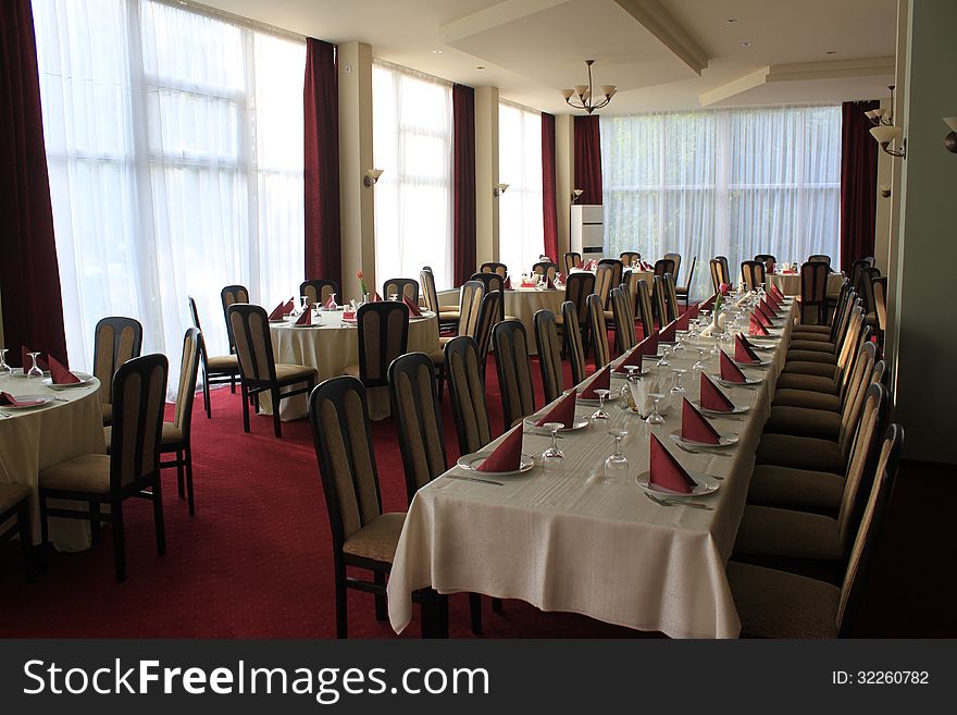 Interior of a hotel fine dining restaurant tables and chairs. Interior of a hotel fine dining restaurant tables and chairs