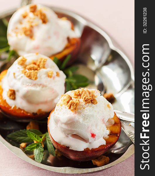 Grilled peaches and ice cream dessert. Grilled peaches and ice cream dessert