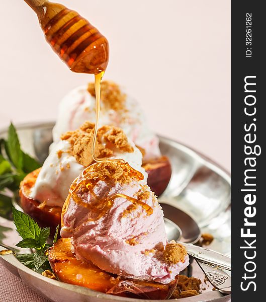 Grilled peaches and ice cream dessert. Grilled peaches and ice cream dessert