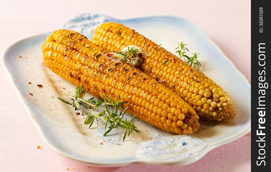 Grilled corn on the cob with butter and spices