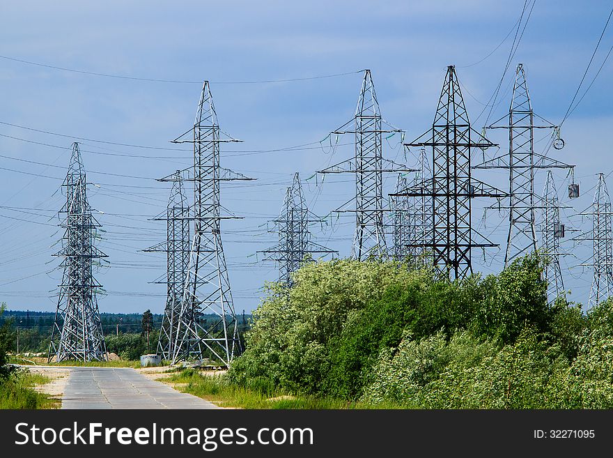 Power mast against the sky with shrub. Power mast against the sky with shrub