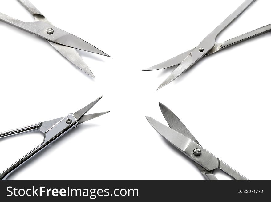 Set of four manicure scissors on white background. Set of four manicure scissors on white background