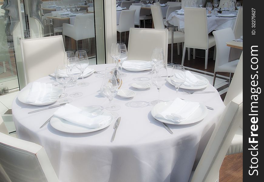 White restaurant awaits guests in the afternoon. White restaurant awaits guests in the afternoon