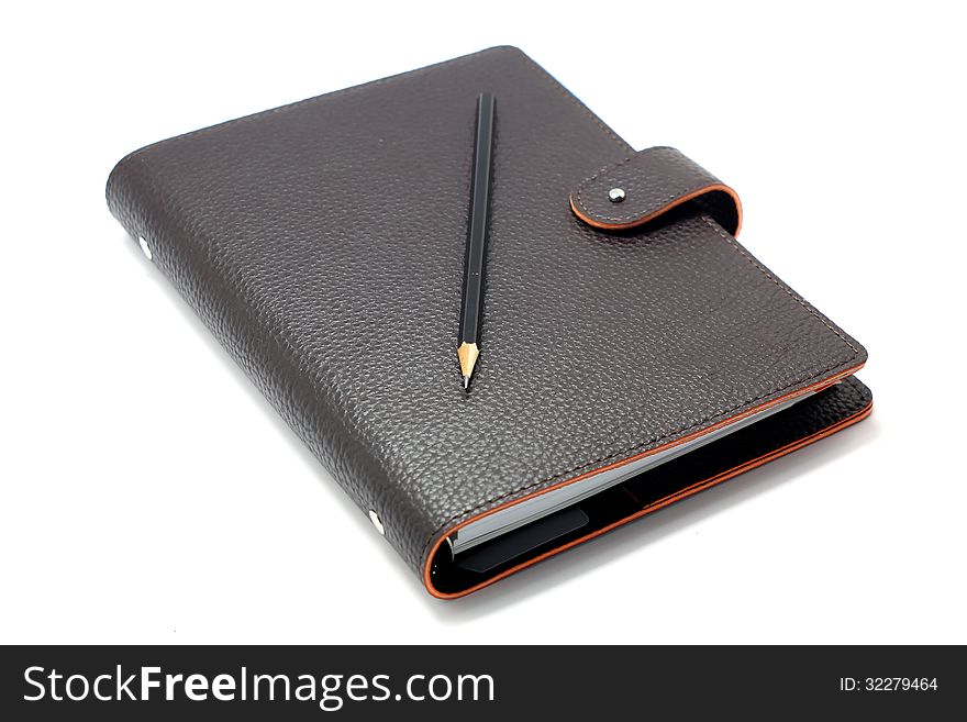 Notebook with pencil  on white background