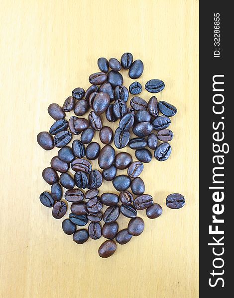 Coffee beans on wood background