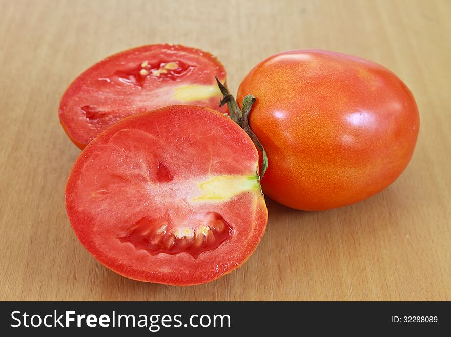 Tomatos on wood table background